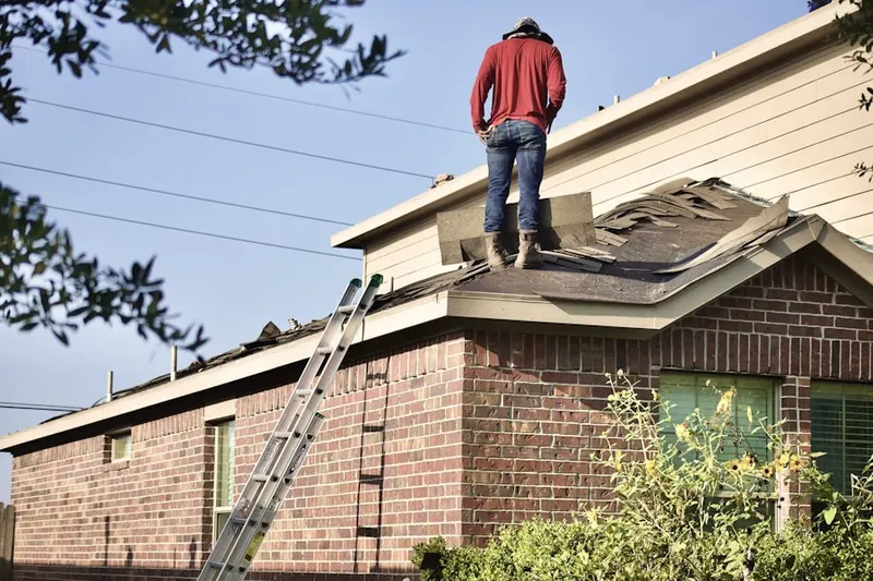 Professional roofer working on a residential roof in Crystal Point